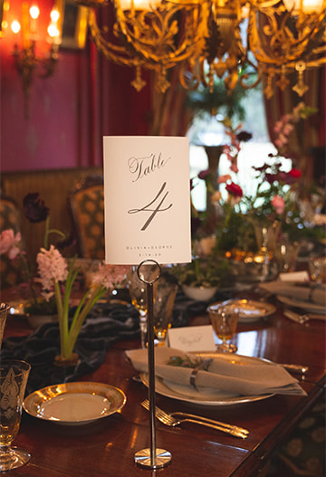 Table numbers, tablescpe, place setting, chandelier, florals, wedding reception