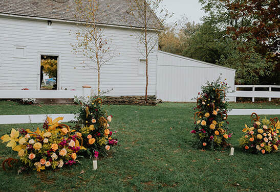 Barn entrance, ceremony, wedding, florals
