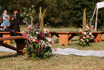 Ceremony seating, florals, wedding ceremony