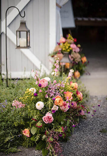 Floral arrangement, lighting, entrance, wedding reception
