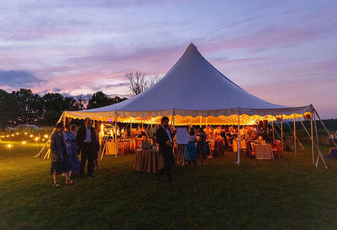 Wedding tent entrance, guests, lighting, outdoor wedding