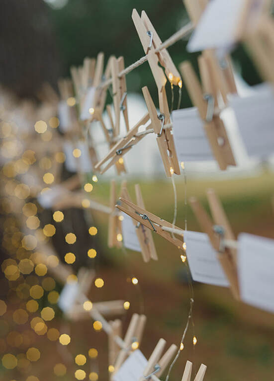 wedding, outdoor venue, table numbers, lights, cloths line