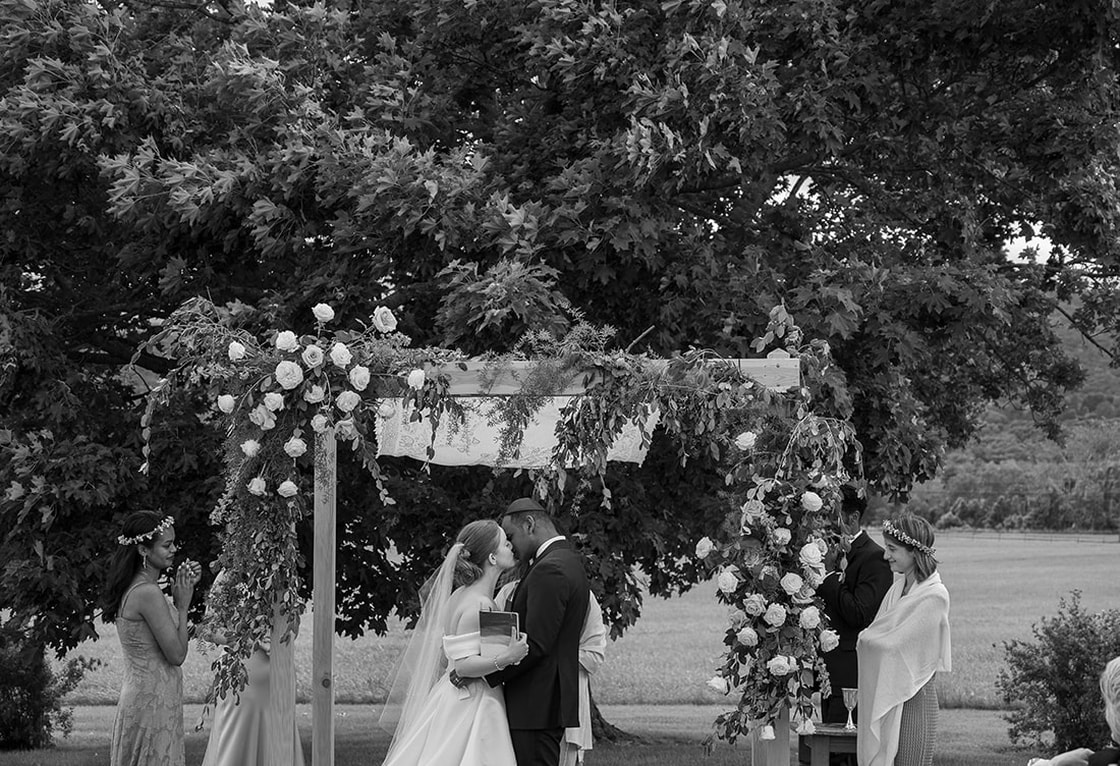 bride and groom, outdoor wedding ceremony, floral arrangement