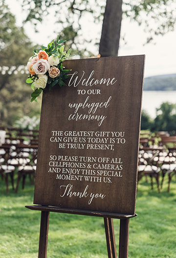 Signage, wedding ceremony, unplugged, florals, seating, outdoor wedding