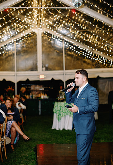 Wedding reception, guests, speech, tent lighting