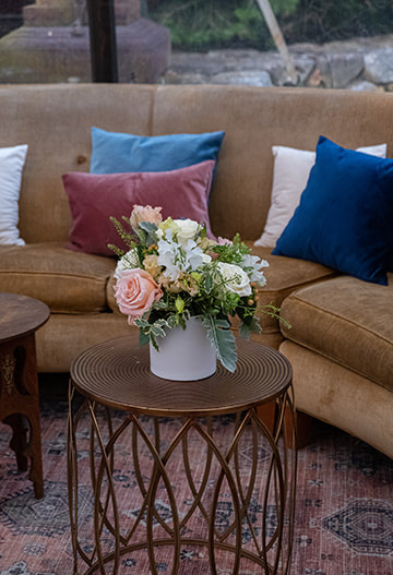 wedding reception, comfortable seating, floral arrangement
