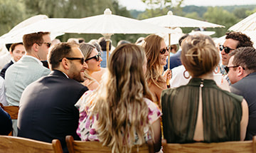 outdoor wedding, seating, umbrella, guests
