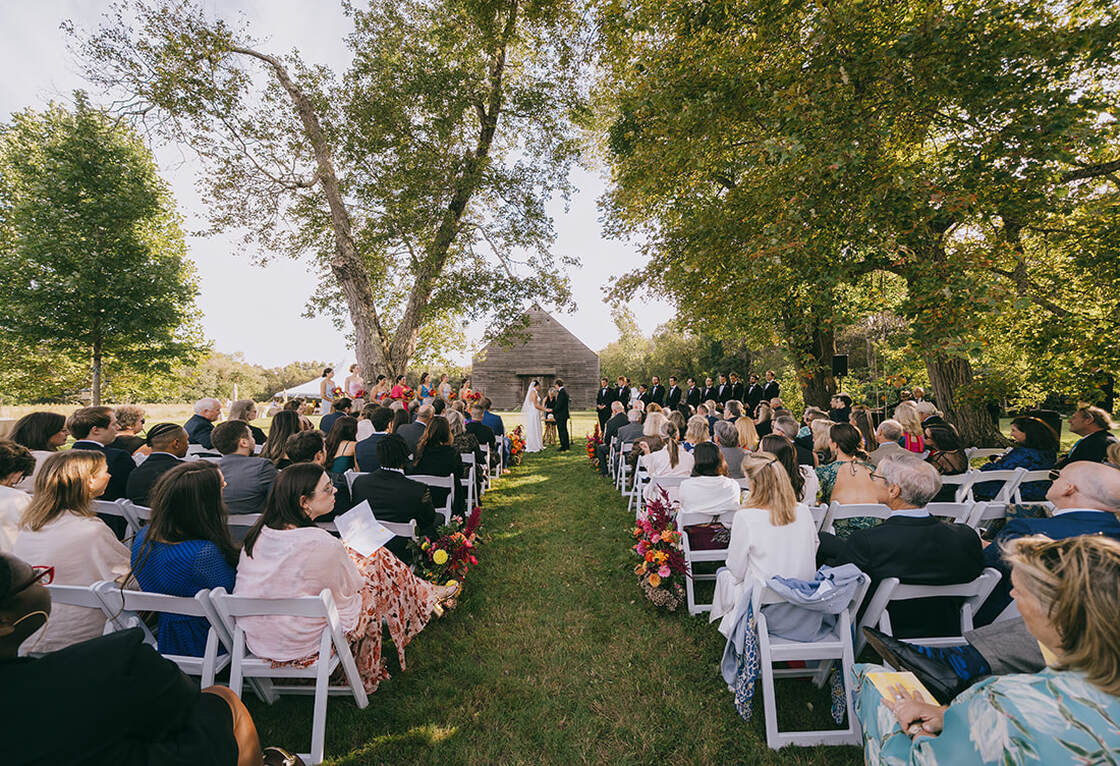 Wedding ceremony, bride and groom, aisle, flowers, guests, seating