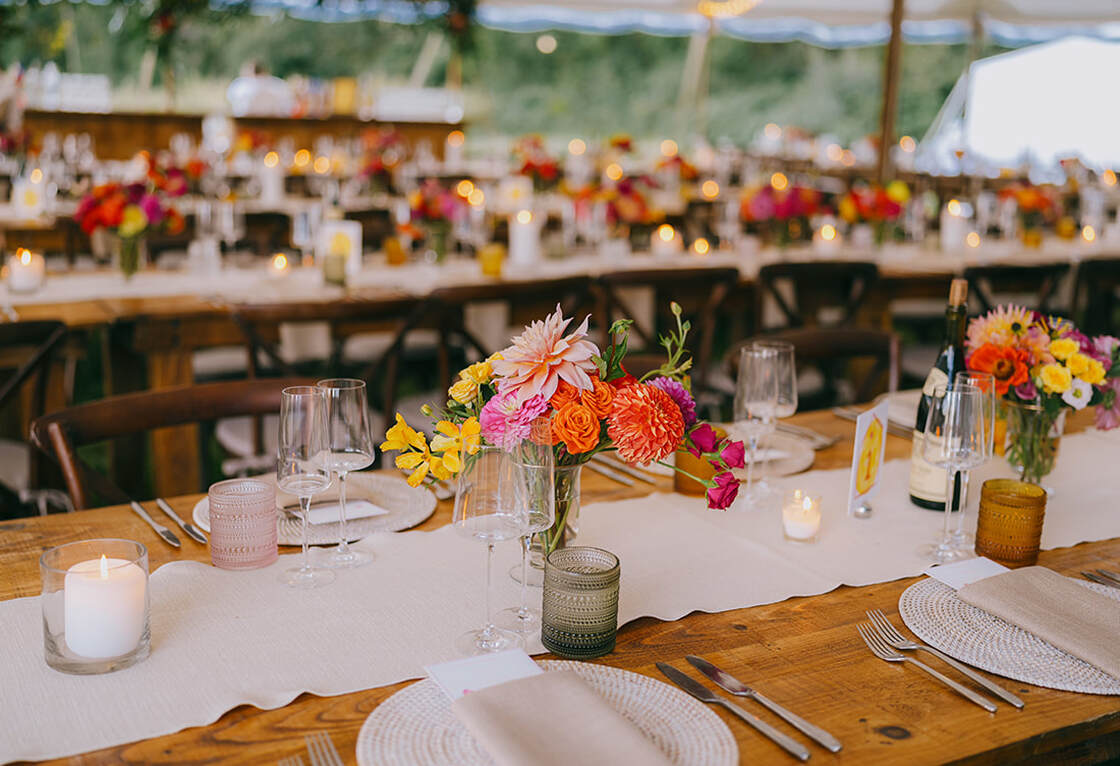 Wedding tent, reception, tablescape, floral arrangement, place setting & signage