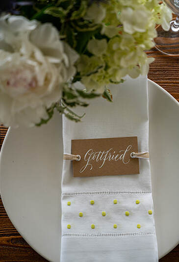private wedding venue, table setting, signage, outdoor wedding
